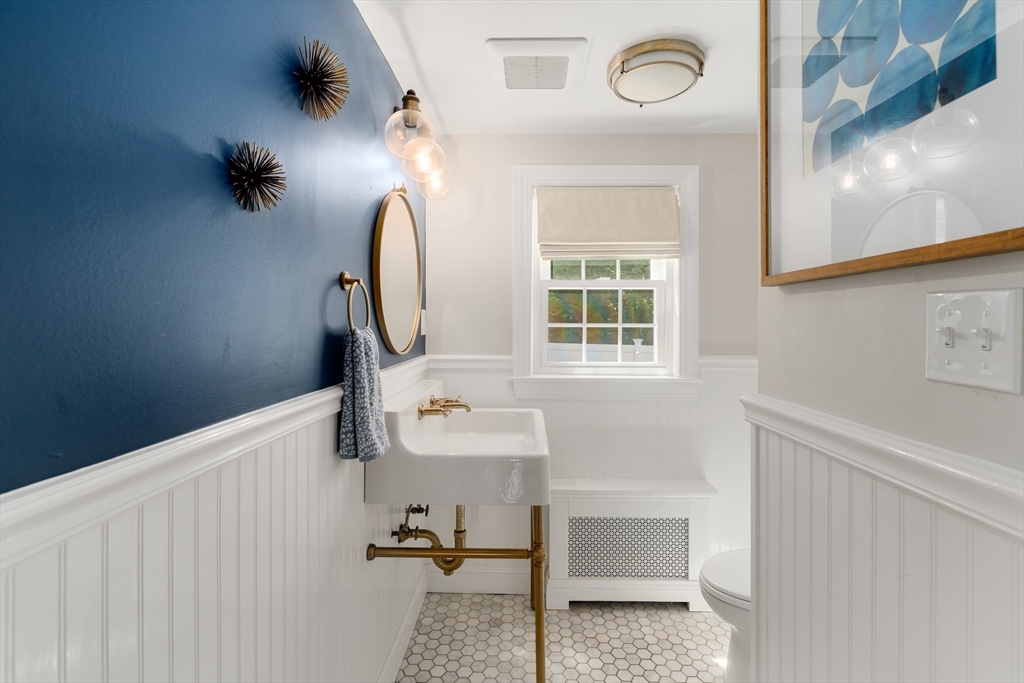 40 Hooper Street Westwood, MA 02090 - Photo 19 of 39 a bathroom with a sink and a mirror
