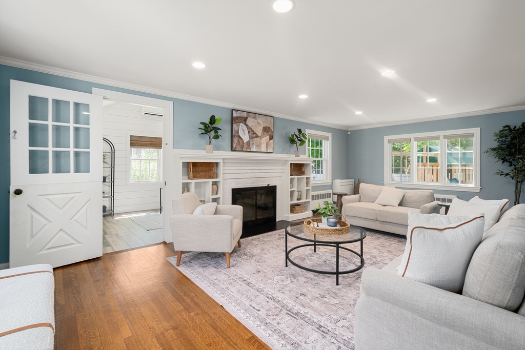40 Hooper Street Westwood, MA 02090 - Photo 2 of 39 a living room with furniture and a fireplace