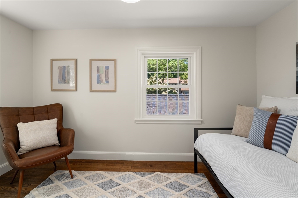 40 Hooper Street Westwood, MA 02090 - Photo 26 of 39 a bedroom with a bed and a chair