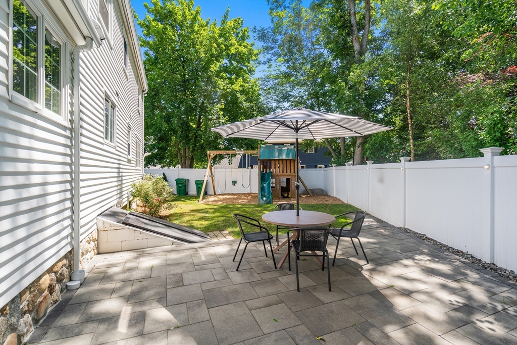 40 Hooper Street Westwood, MA 02090 - Photo 30 of 39 a view of backyard with seating space and trees