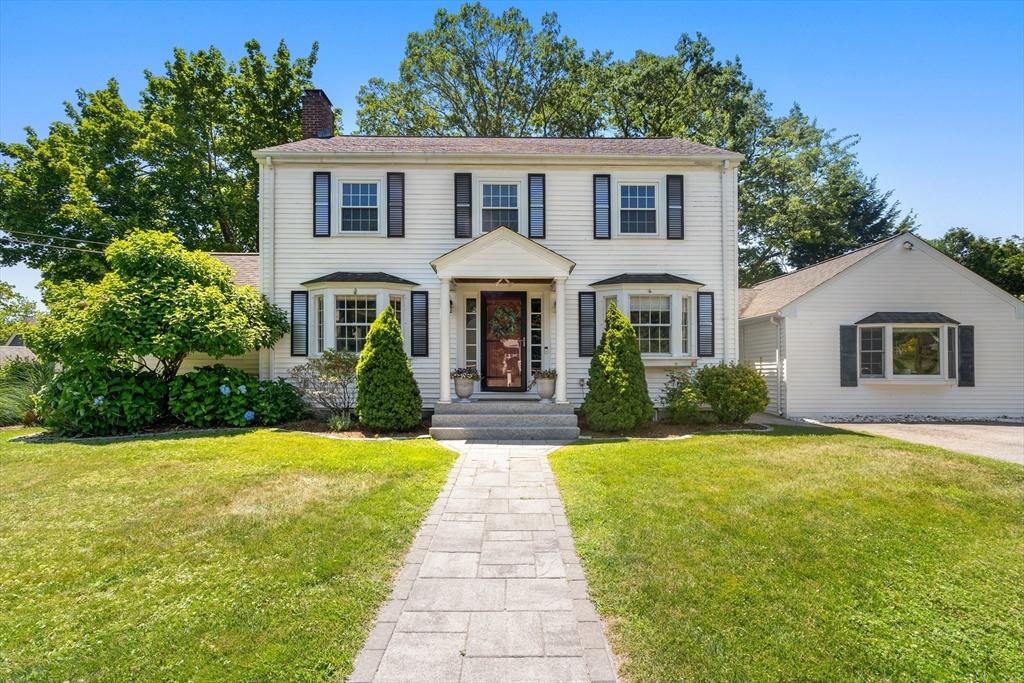 40 Hooper Street Westwood, MA 02090 - Photo 36 of 39 a front view of a house with yard and green space