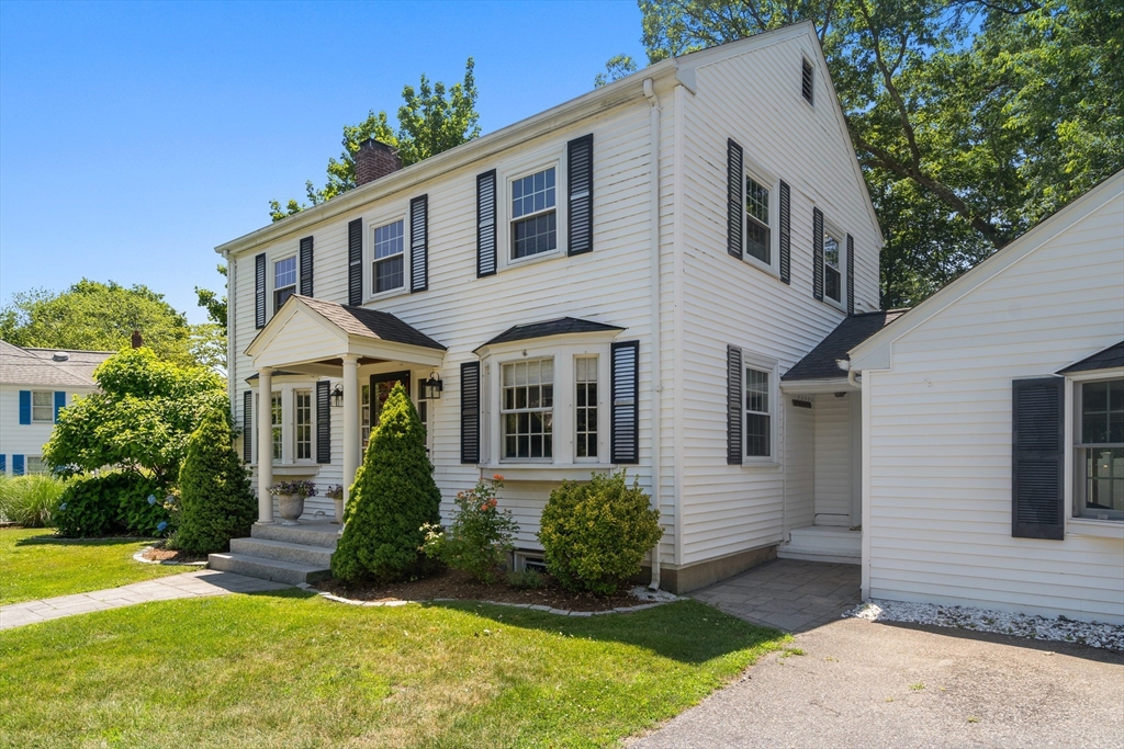 40 Hooper Street Westwood, MA 02090 - Photo 38 of 39 a front view of a house with a yard and porch