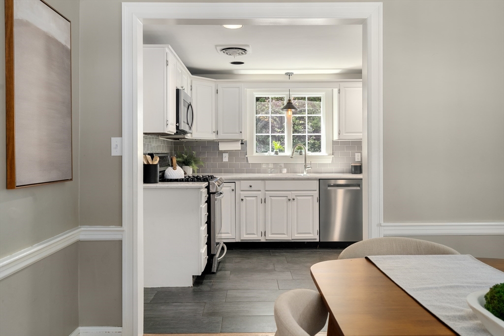 40 Hooper Street Westwood, MA 02090 - Photo 10 of 39 a kitchen with a sink stove and cabinets