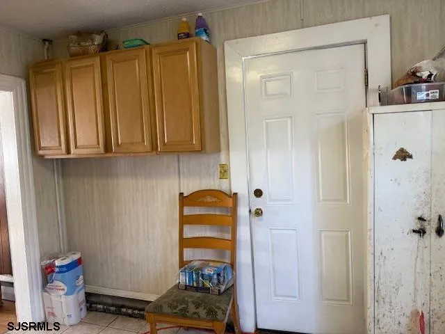 a view of a kitchen with dining table and chairs