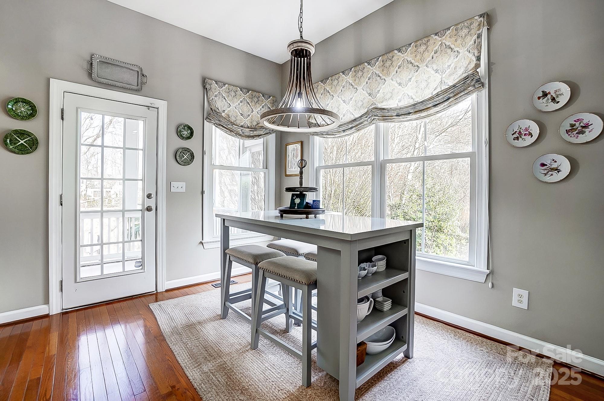 134 Mills Lane Fort Mill, SC 29708 - Photo 12 of 45 a kitchen with stainless steel appliances granite countertop a stove and a wooden floors