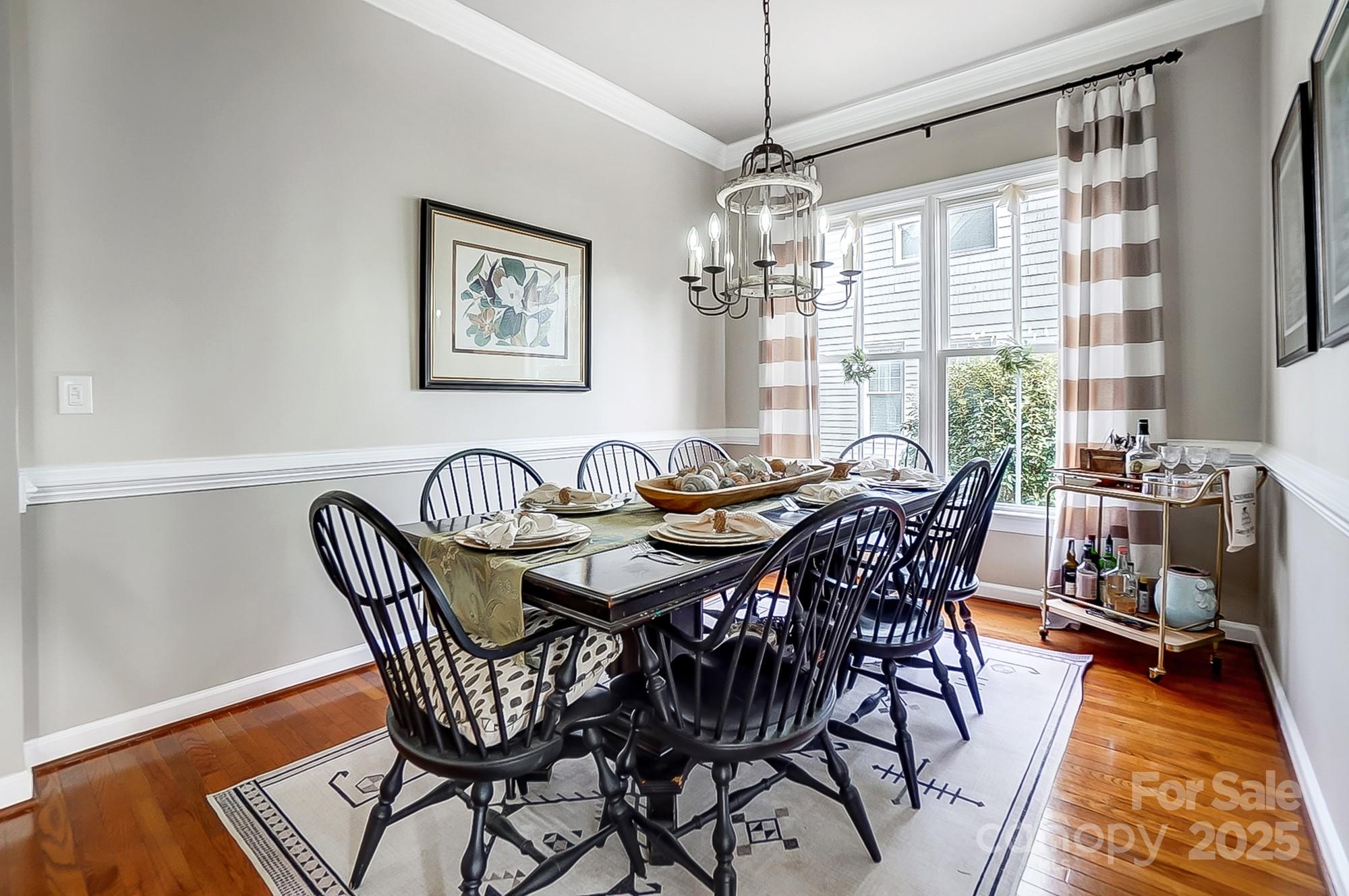 134 Mills Lane Fort Mill, SC 29708 - Photo 14 of 45 a view of a dining room with furniture window and wooden floor
