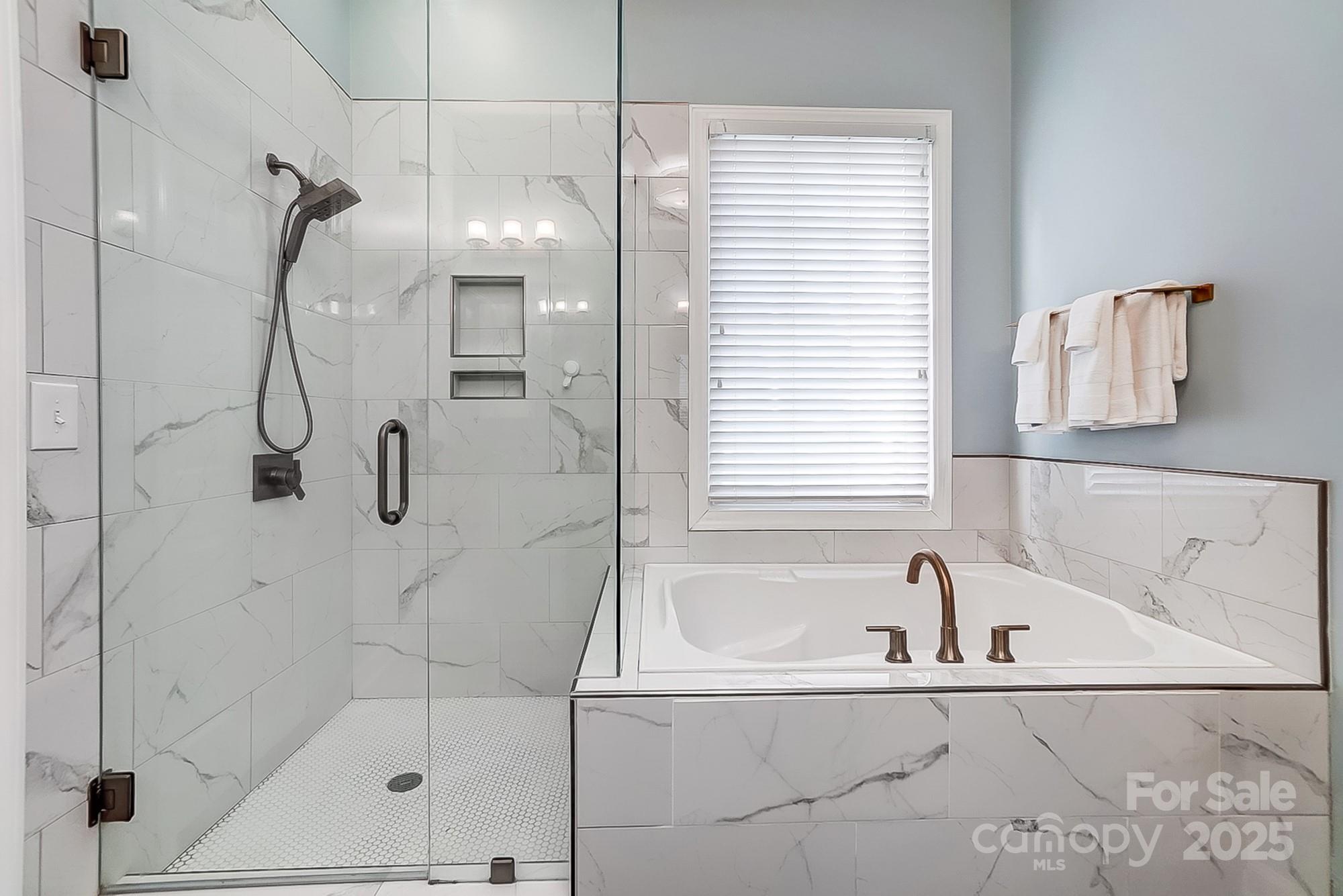 134 Mills Lane Fort Mill, SC 29708 - Photo 24 of 45 a bathroom with a bath tub and shower