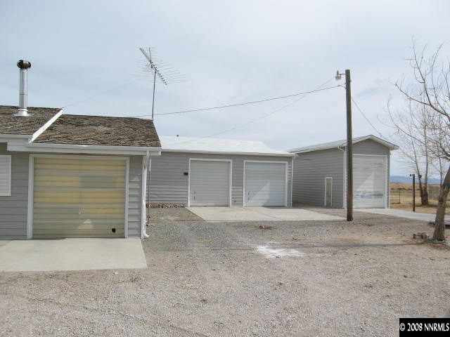 6555 Curry Road Fallon, NV 89406 - Photo 1 of 9 a view of a house with a garage