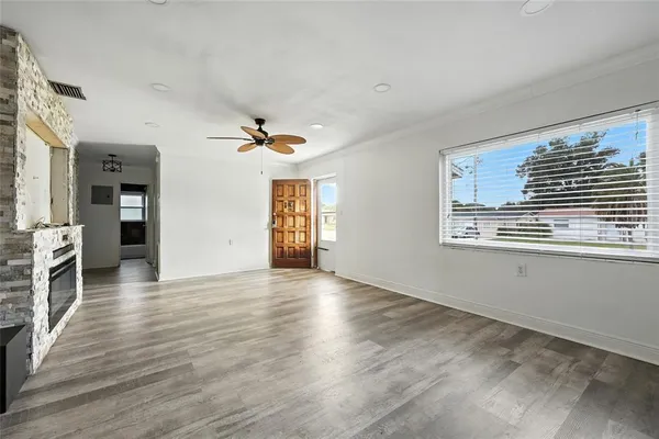 a view of livingroom with hardwood floor and a ceiling fan