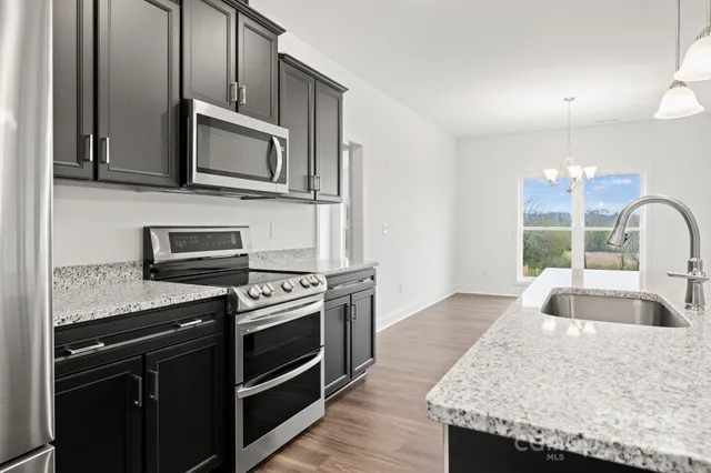 a large bathroom with a granite countertop sink a bathtub and a shower