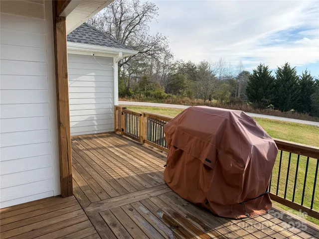 a view of a balcony with wooden floor