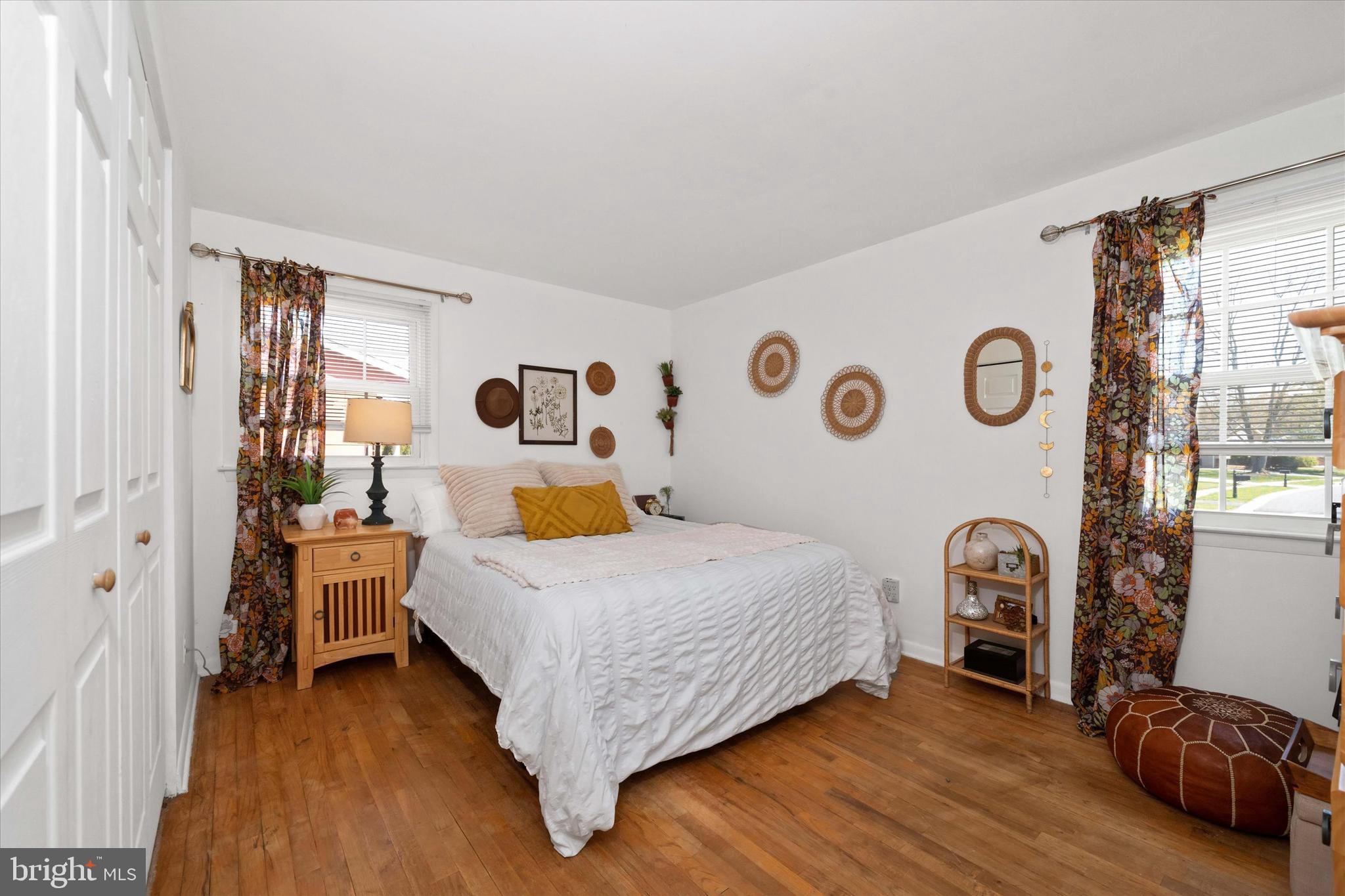 141 West Rutherford Drive Newark, DE 19713 - Photo 14 of 30 a bedroom with a bed and a large window with wooden floor