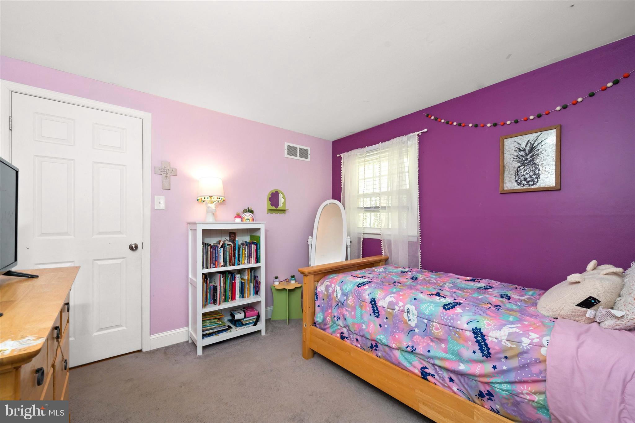 141 West Rutherford Drive Newark, DE 19713 - Photo 18 of 30 a bedroom with a bed and a bookshelf