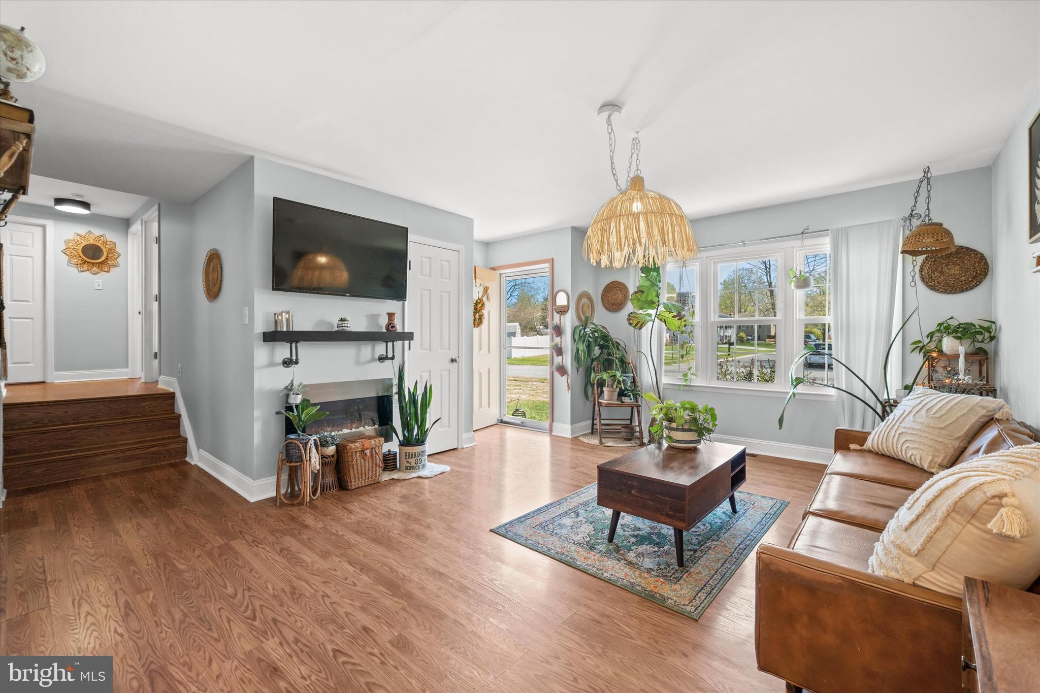 141 West Rutherford Drive Newark, DE 19713 - Photo 8 of 30 a living room with furniture a fireplace and a flat screen tv