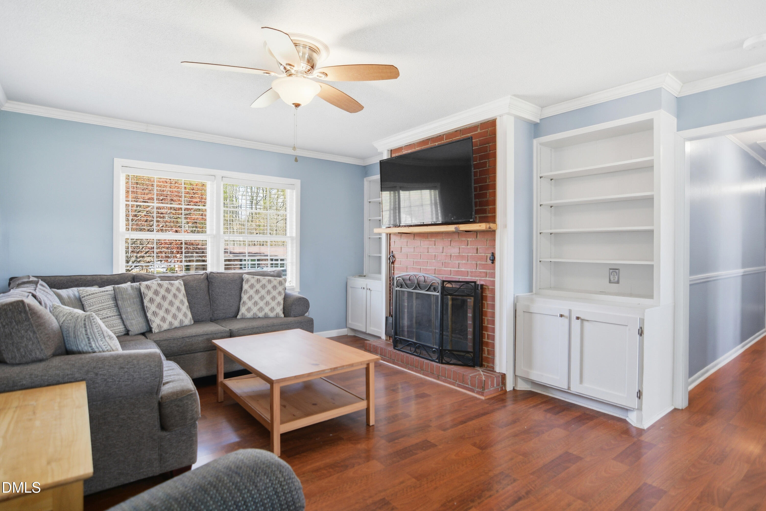 352 Eden Hills Road Siler City, NC 27344 - Photo 4 of 29 a living room with furniture and a fireplace