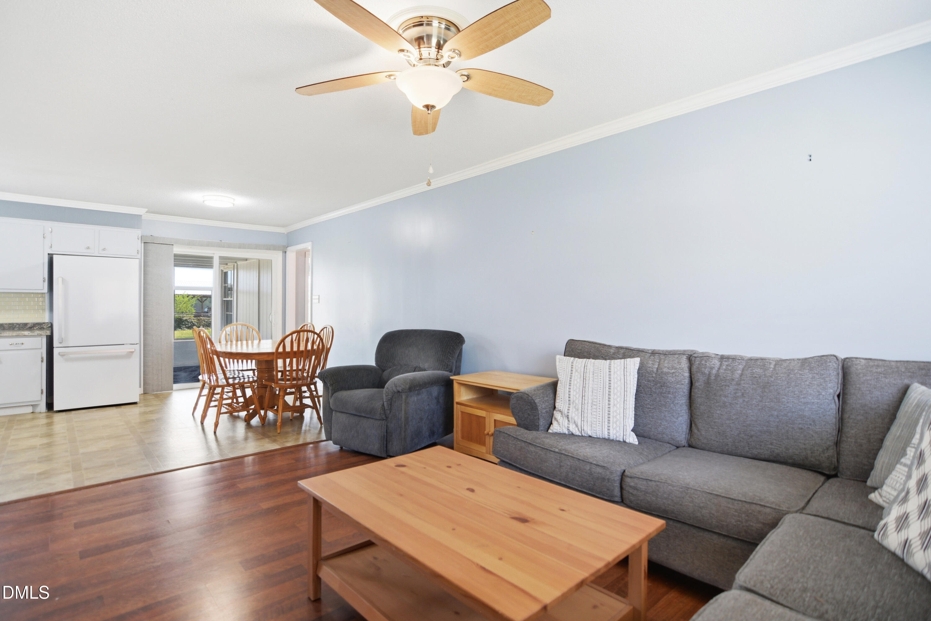 352 Eden Hills Road Siler City, NC 27344 - Photo 5 of 29 a living room with furniture ceiling fan and a wooden floor