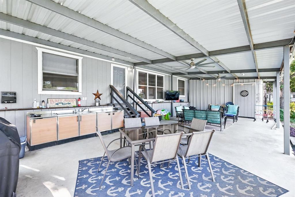 150 Red Bluff Loop Mabank, TX 75156 - Photo 10 of 26 a view of a dining room with furniture and a chandelier