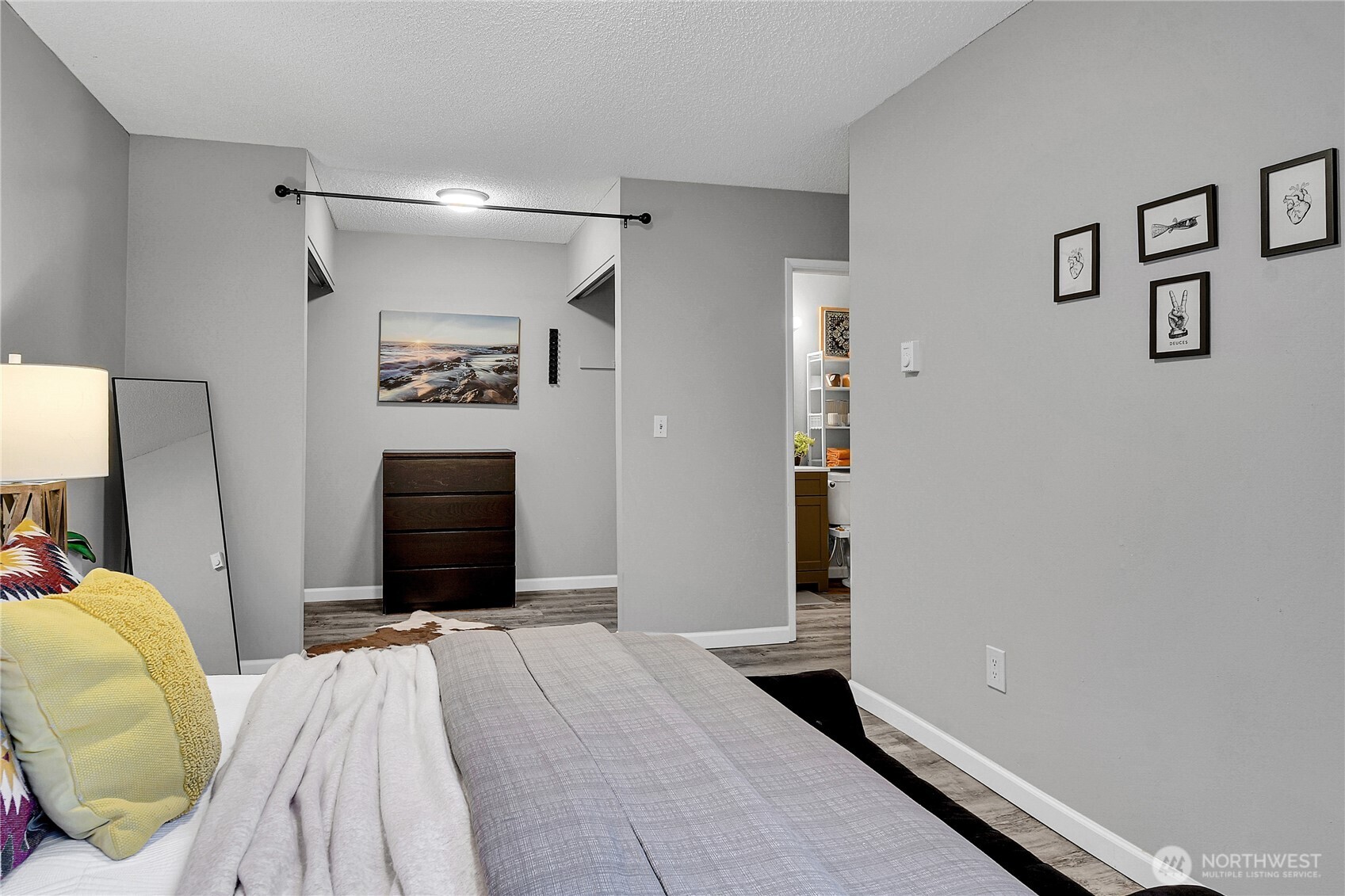 2562 Thorndyke Avenue West, Unit 104 Seattle, WA 98199 - Photo 10 of 18 a bedroom with a bed and a television