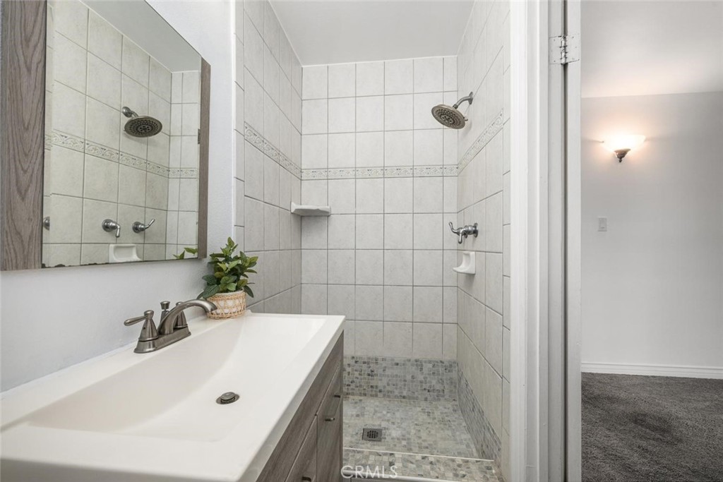 1238 North Studebaker Road Long Beach, CA 90815 - Photo 32 of 47 a bathroom with a sink and shower