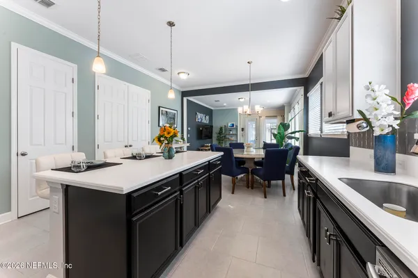 a en suite bathroom with a double vanity sink a mirror and shower