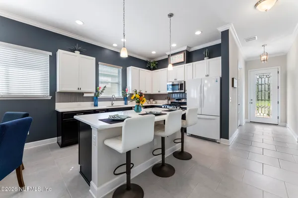 a spacious bathroom with a toilet a sink and a mirror
