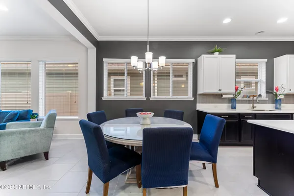 a living room with furniture gym equipment and a large window