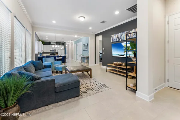a dining room with furniture and window