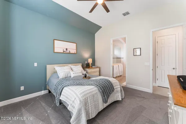 a view of a patio with table and chairs and potted plants