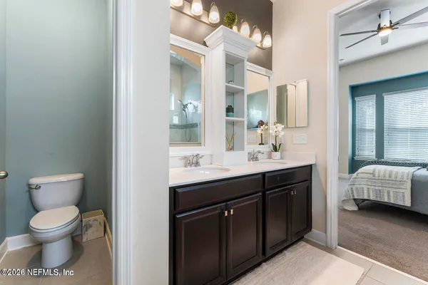 an aerial view of residential houses with outdoor space and a lake view