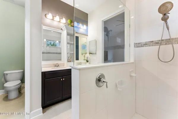 an aerial view of multiple houses with yard