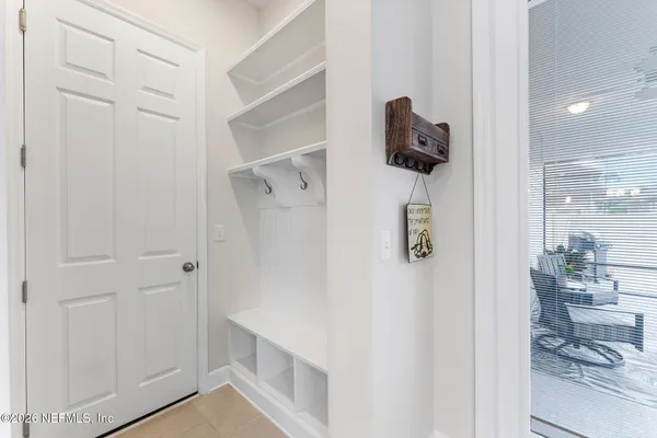 a table with chairs and painting on it