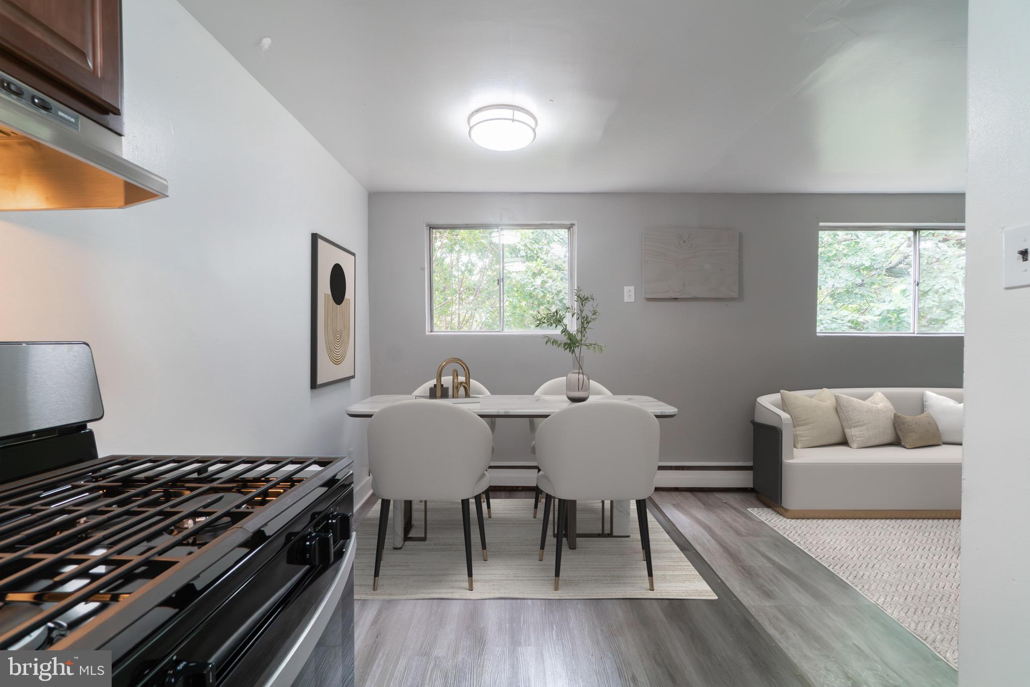 4616 Leiper Street, Unit B12 Philadelphia, PA 19124 - Photo 3 of 11 a living room with furniture and a window