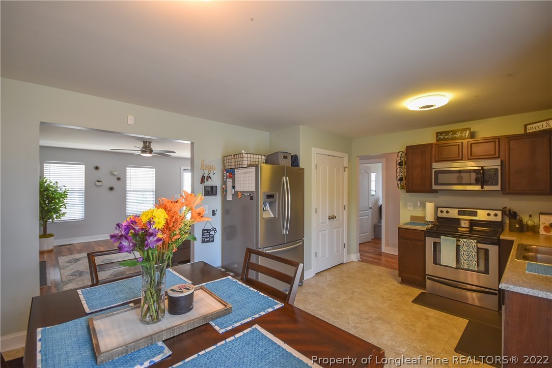 37 Jumpmaster Drive Broadway, NC 27505 - Photo 19 of 48 a living room with stainless steel appliances furniture wooden floor and a view of kitchen