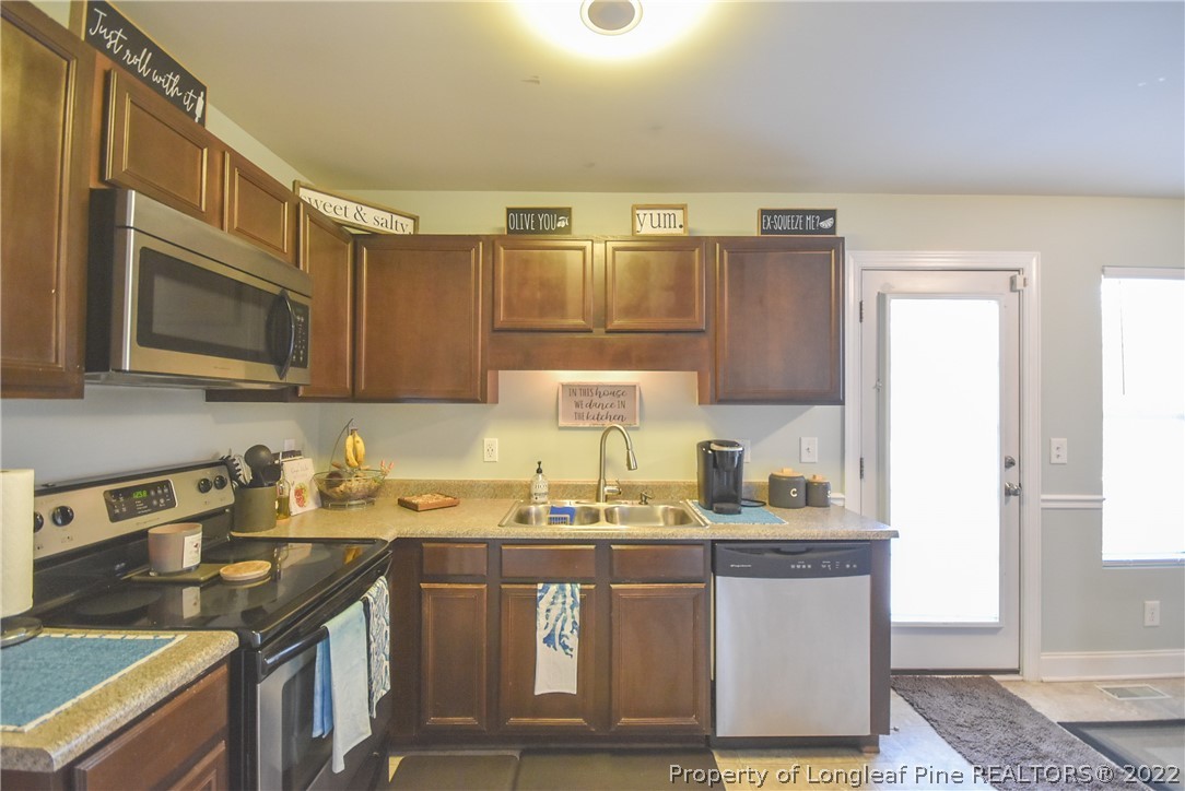 37 Jumpmaster Drive Broadway, NC 27505 - Photo 22 of 48 a kitchen with sink cabinets and microwave
