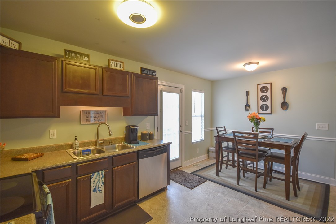 37 Jumpmaster Drive Broadway, NC 27505 - Photo 23 of 48 a kitchen with granite countertop a sink cabinets and stove top oven
