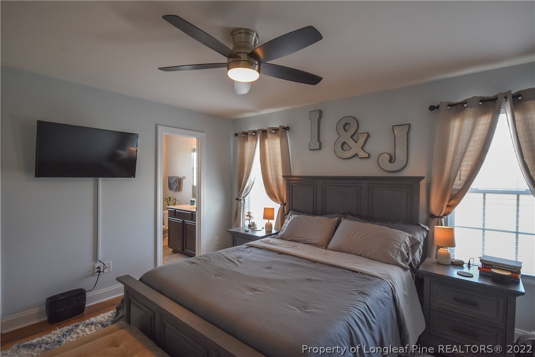 37 Jumpmaster Drive Broadway, NC 27505 - Photo 26 of 48 a bedroom with a bed and a flat screen tv