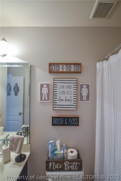37 Jumpmaster Drive Broadway, NC 27505 - Photo 30 of 48 a picture of a bathroom with sink and a mirror