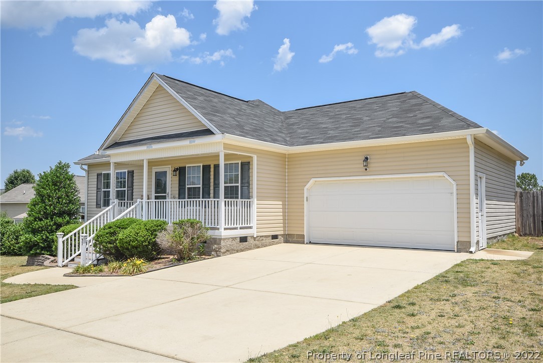 37 Jumpmaster Drive Broadway, NC 27505 - Photo 4 of 48 a front view of a house with a garage