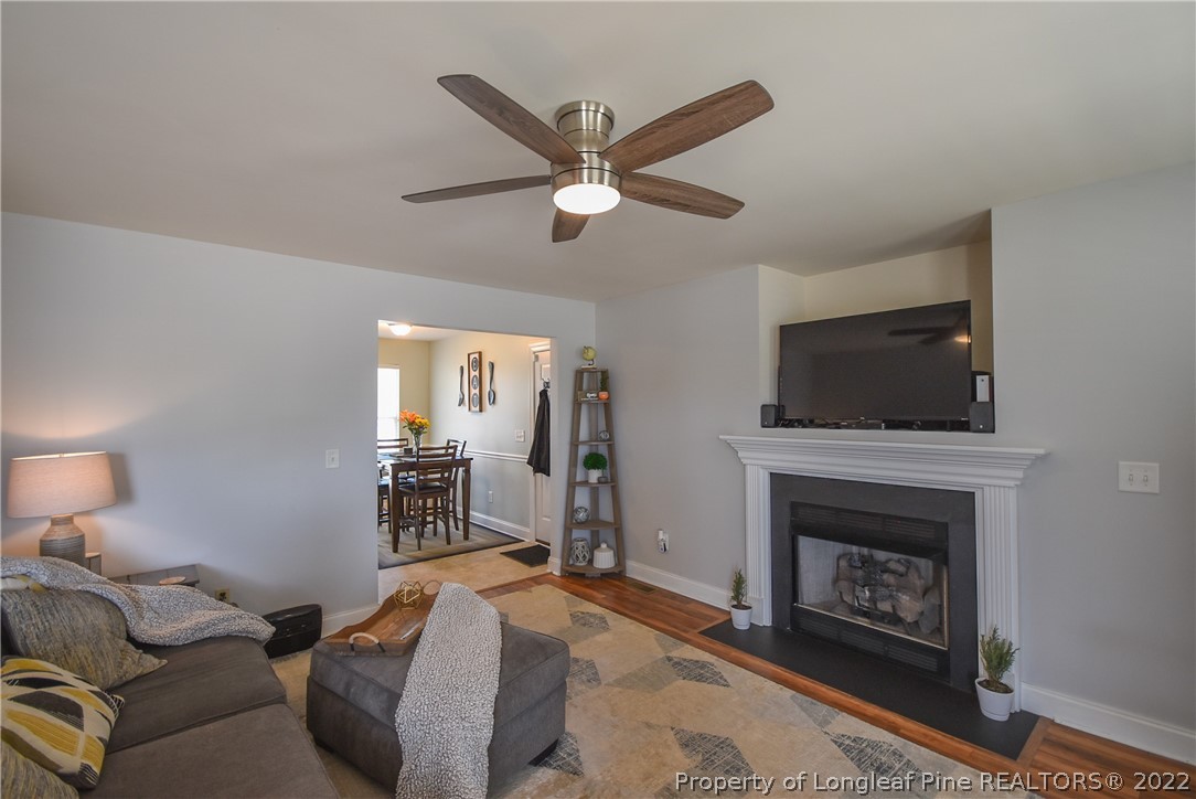 37 Jumpmaster Drive Broadway, NC 27505 - Photo 10 of 48 a living room with furniture a flat screen tv and a fireplace