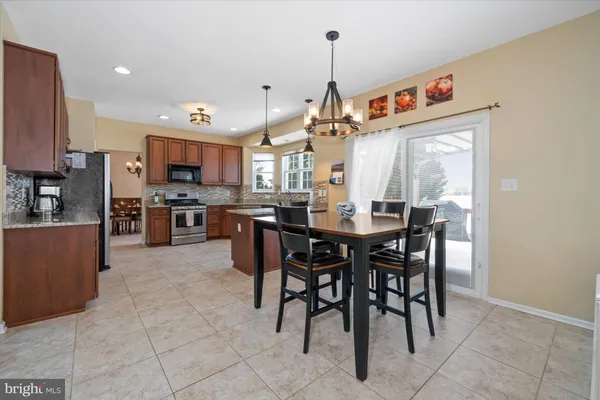 a bedroom with furniture and a flat screen tv