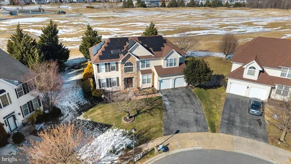 a view of a house with a snow in the yard