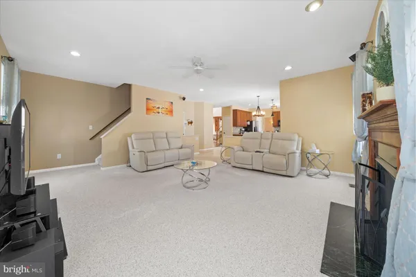 a view of walk in closet with clothes