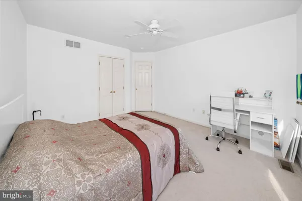 a bathroom with a window and a shower curtain