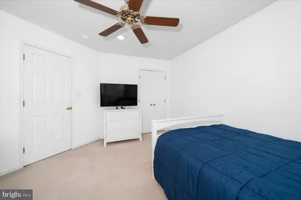 a view of a house with wooden deck