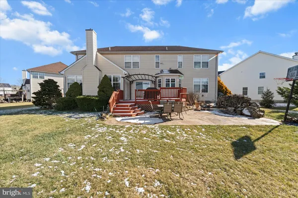 a view of a workspace with furniture and a bookshelf