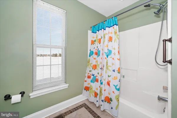 an aerial view of a house with a ocean view