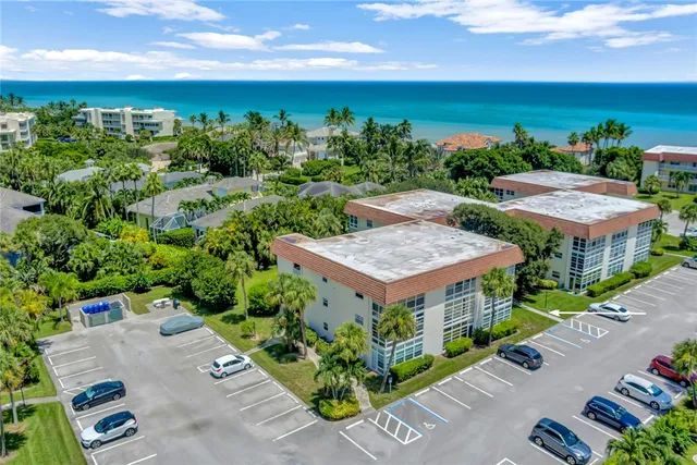 an aerial view of a house with a garden