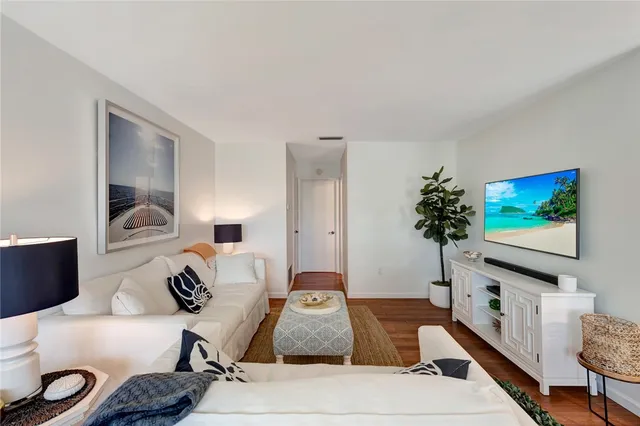 a bedroom with furniture and a flat screen tv