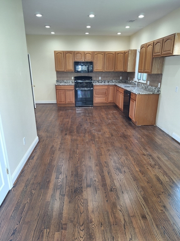 23 Ridgeway Court, Unit 23 Brockton, MA 02301 - Photo 2 of 3 a kitchen with stainless steel appliances a refrigerator and a stove top oven