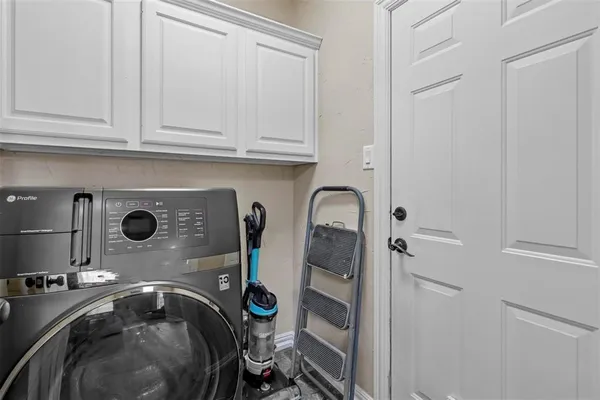 a view of a chair and table in backyard